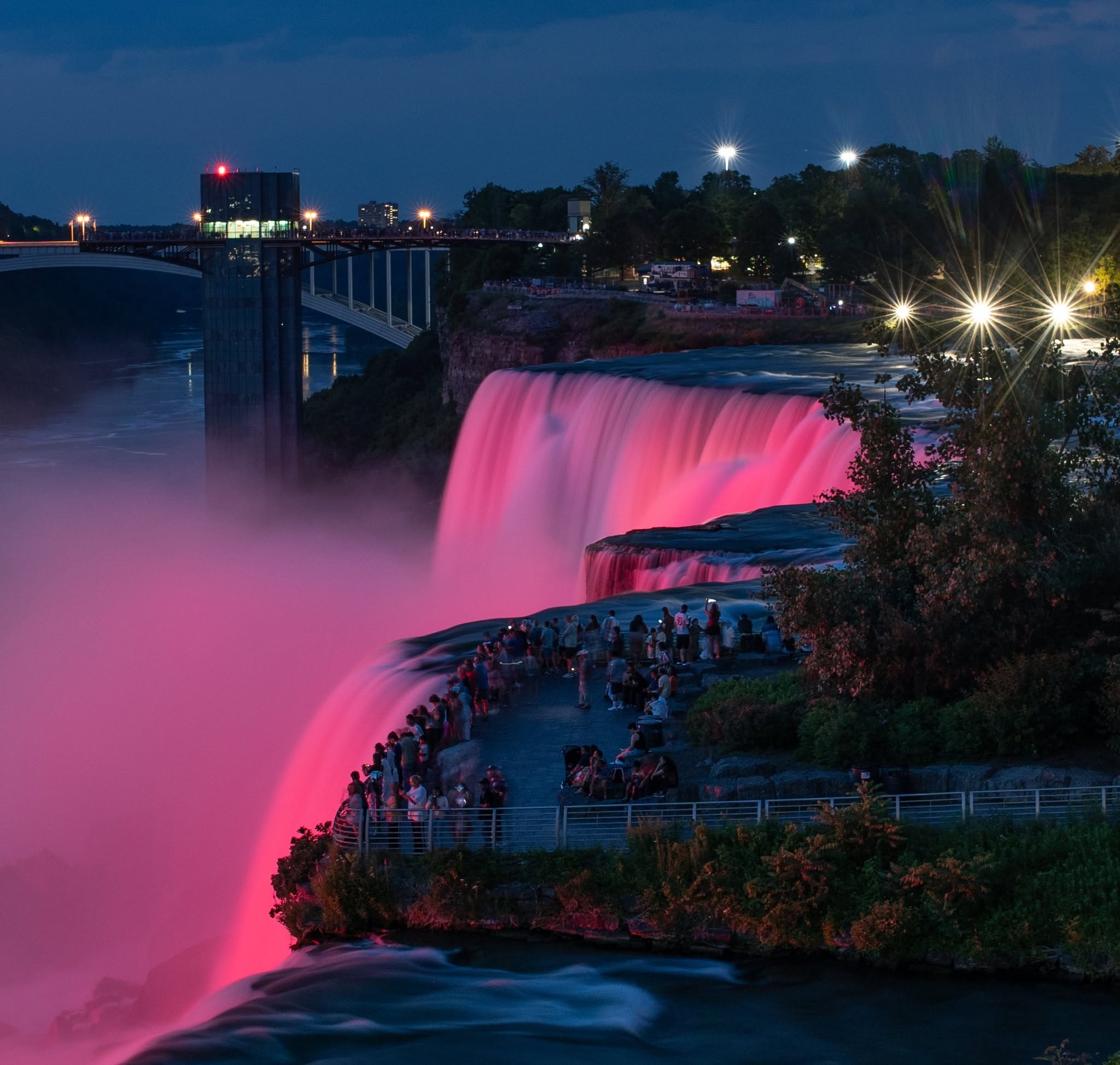 Niagara Falls illuminated pink in honor of Dolly Parton.